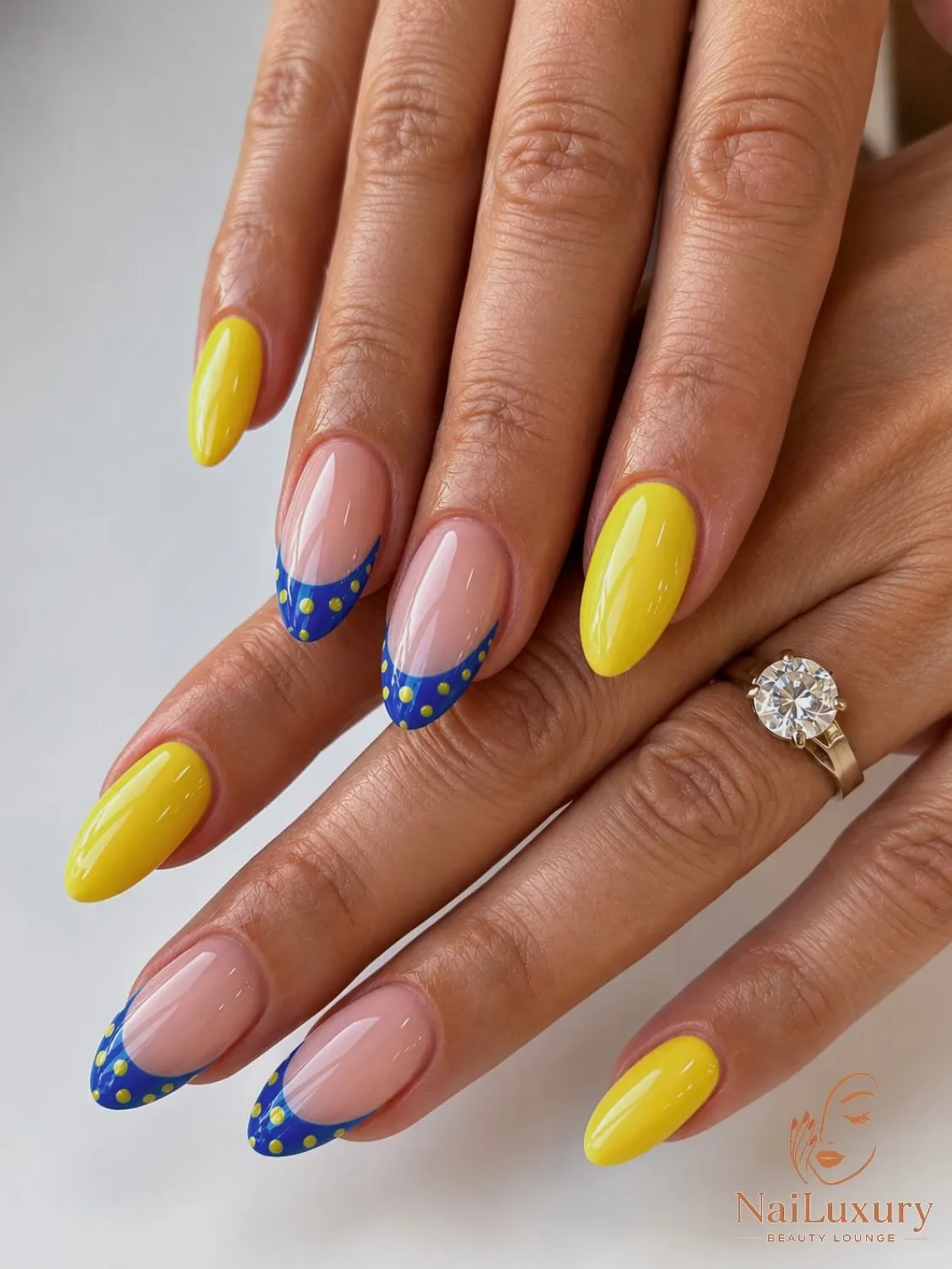 Yellow solids with blue dotted French tips