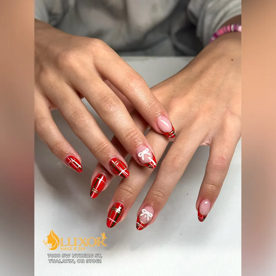 Red plaid nails with white bow accents