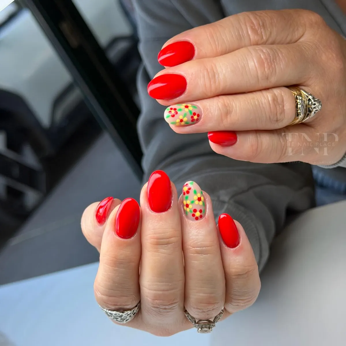 Bright red oval nails with multicolor dotted floral accent nails