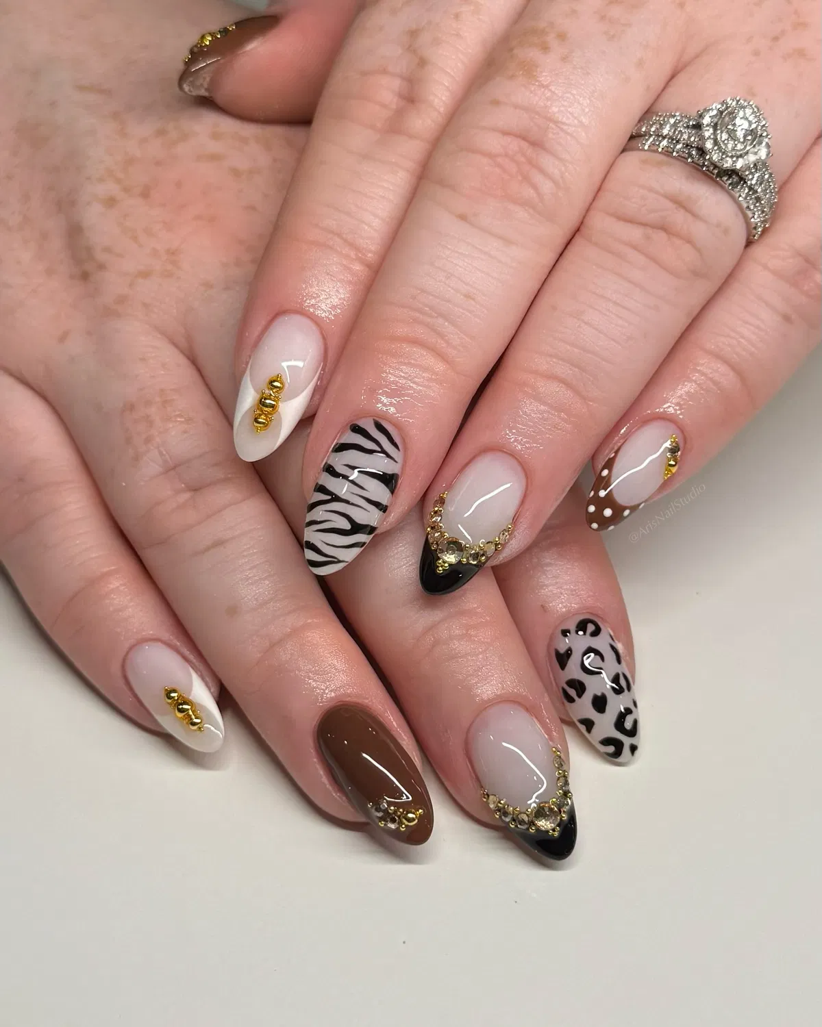 Pattern mix with black tips and gold chain accents
