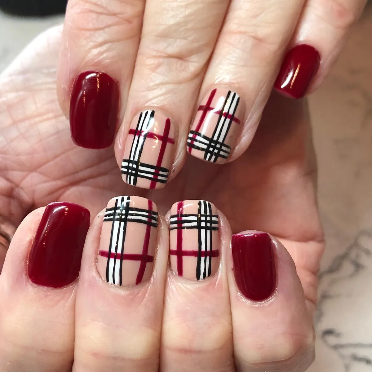 Burgundy solids with nude plaid in black, burgundy, and gold striping