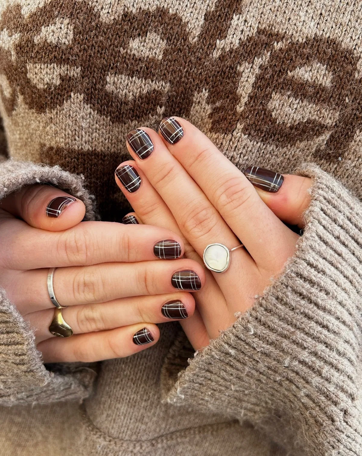 Dark brown plaid grid manicure with thin white lines
