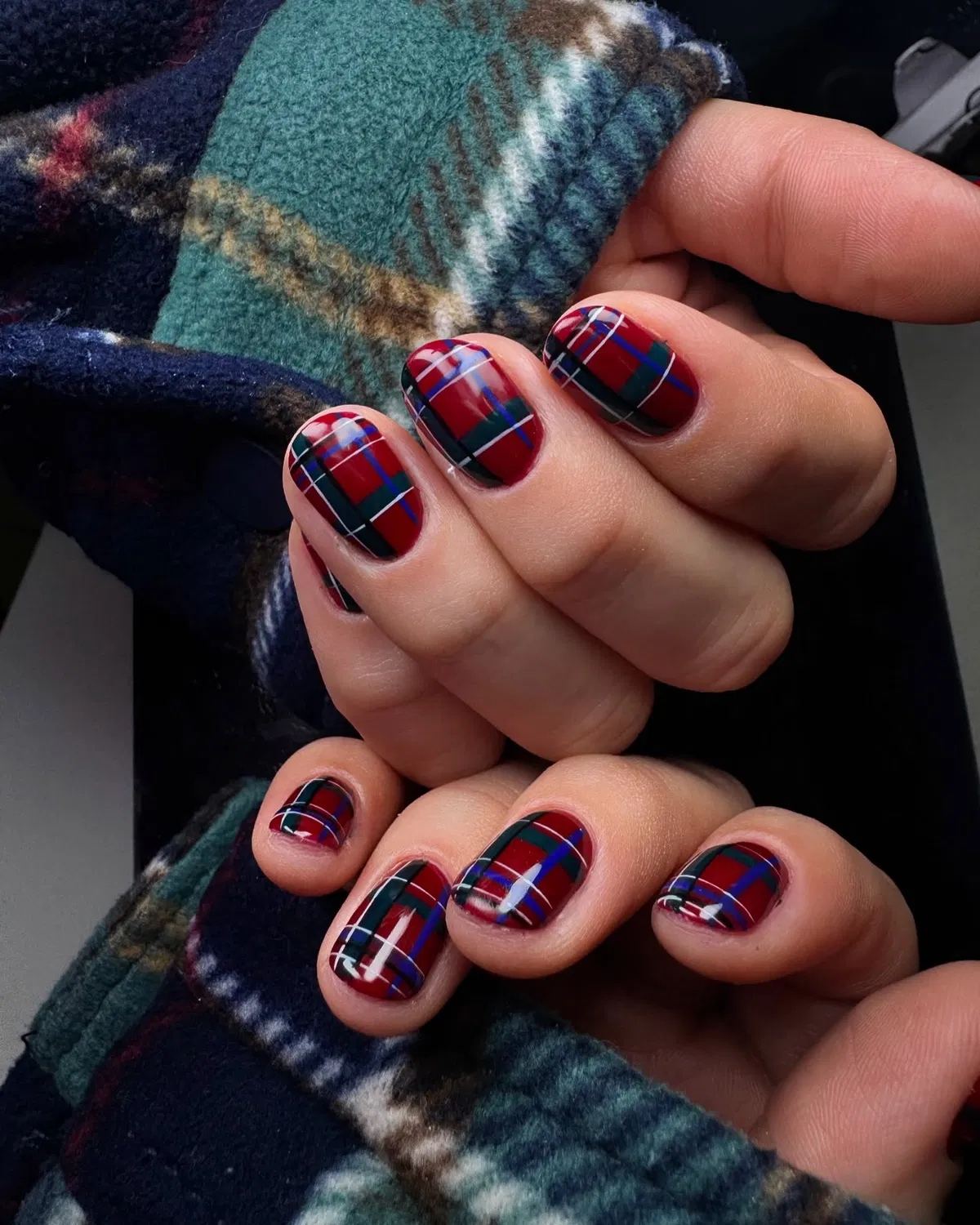 Deep red-and-green tartan plaid nails