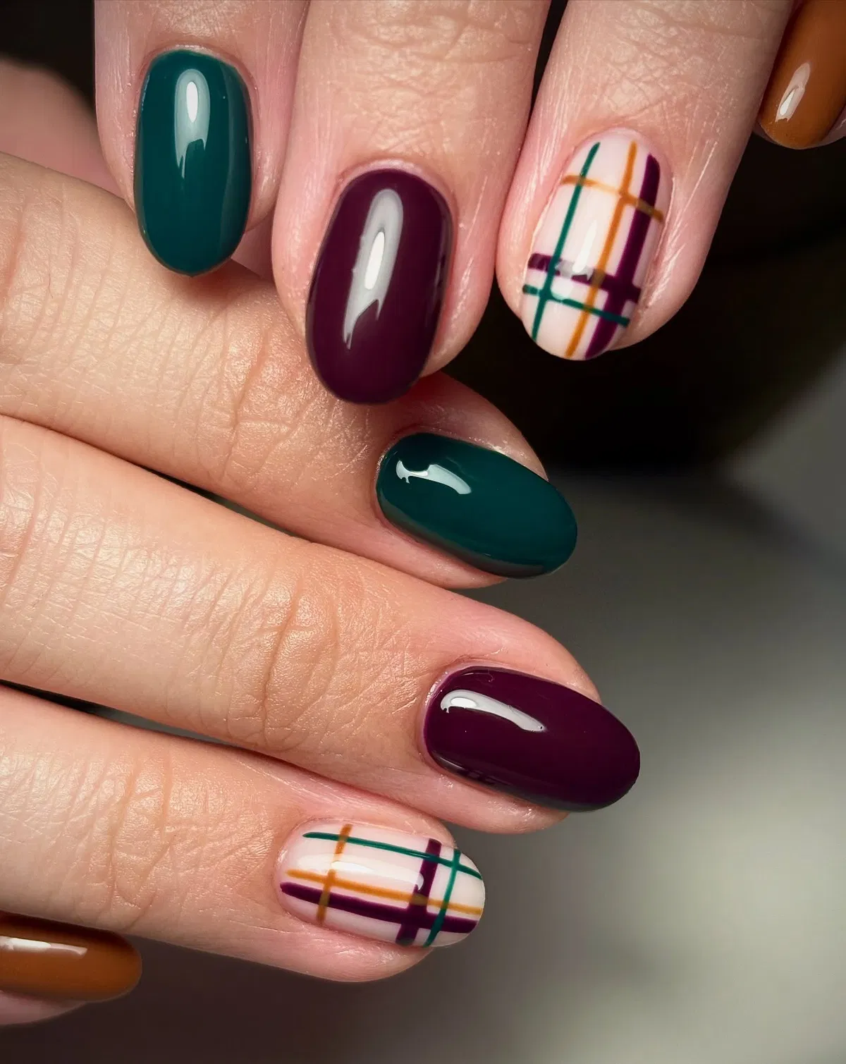 Deep plum and teal with mustard-accent plaid grid nails