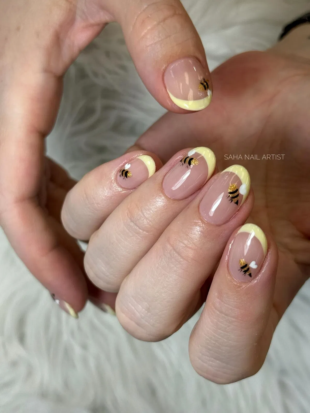 Yellow French tips with tiny bee nail art