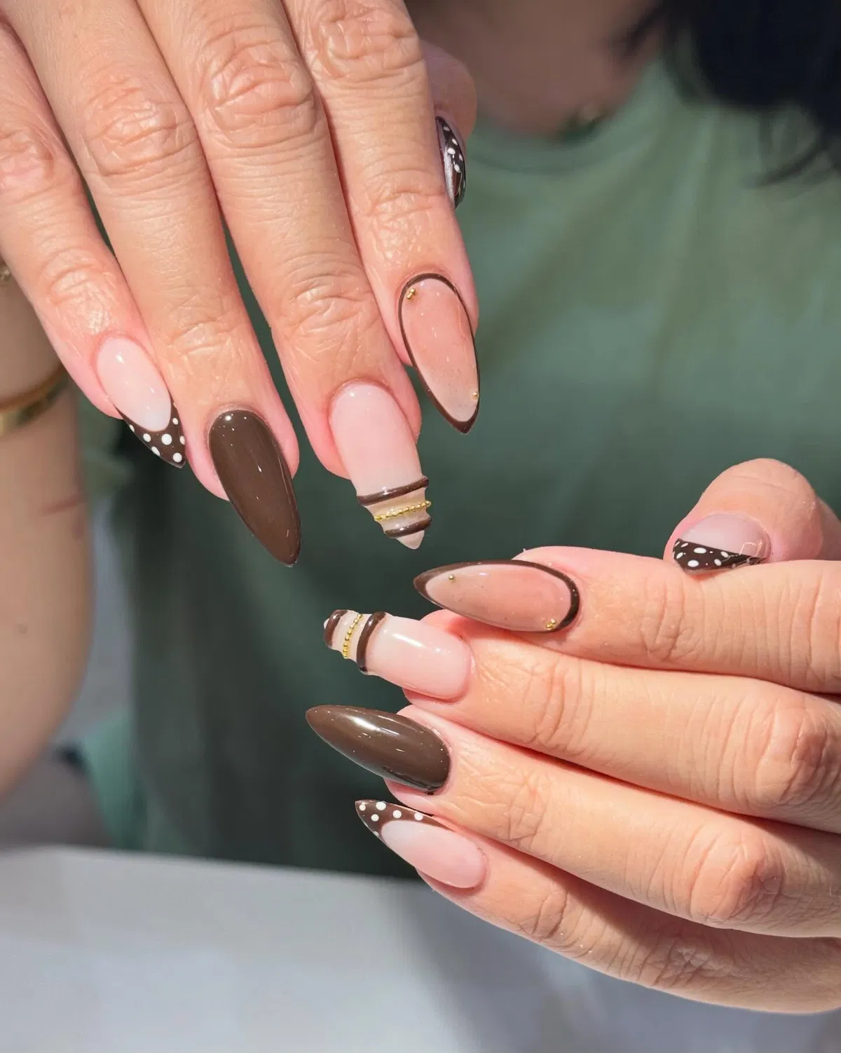 Nude and chocolate French tips with dotted accents
