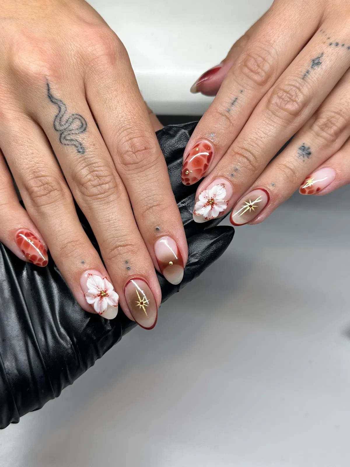 Translucent nude with tortoiseshell patches and gold starbursts