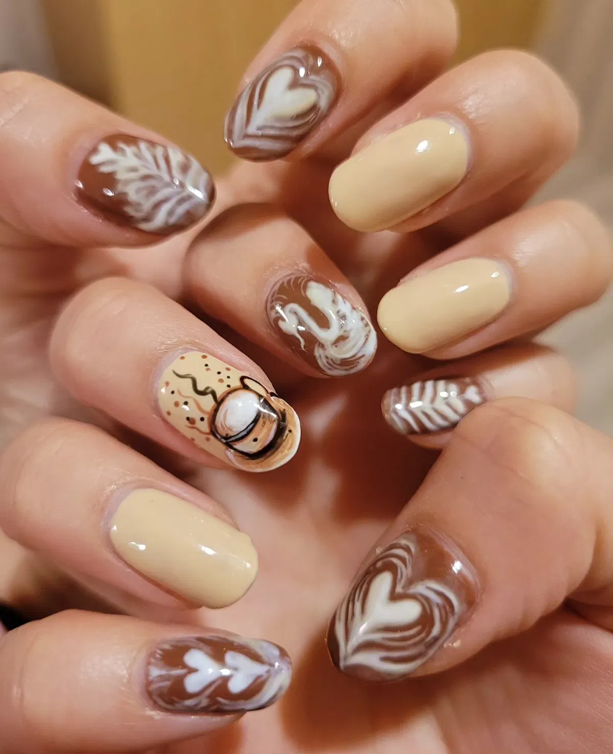 Creamy yellow with brown-white swirls and heart accents