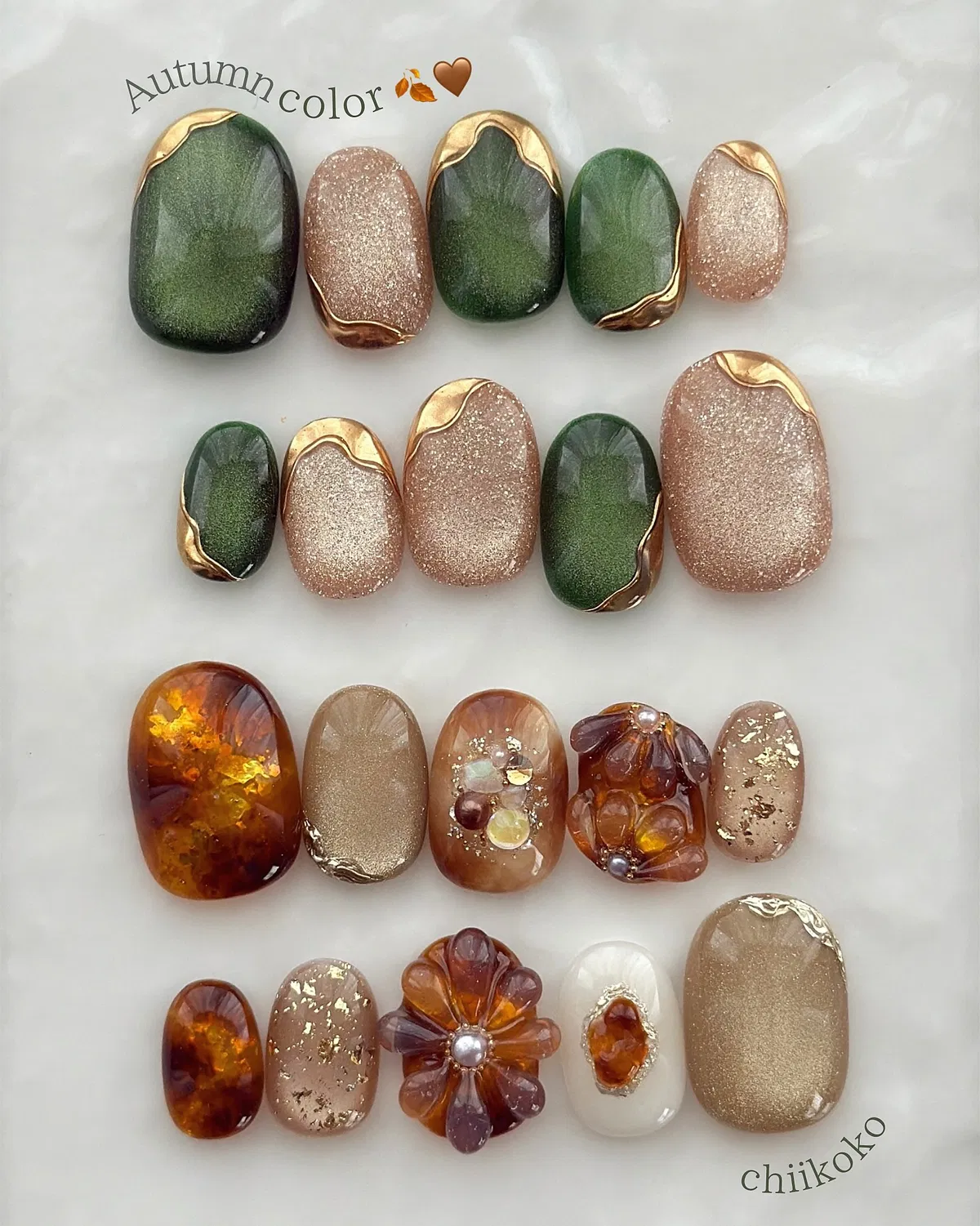 Green-and-gold bordered sets plus amber marbling with gold flecks and 3D floral press-ons