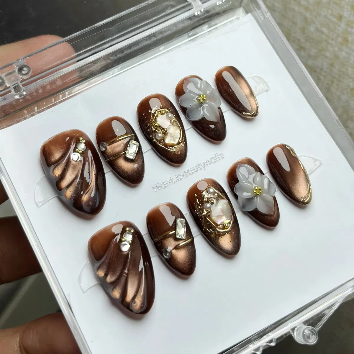 Bronze-brown press-on set with sculpted textures, 3D flowers, and gem clusters