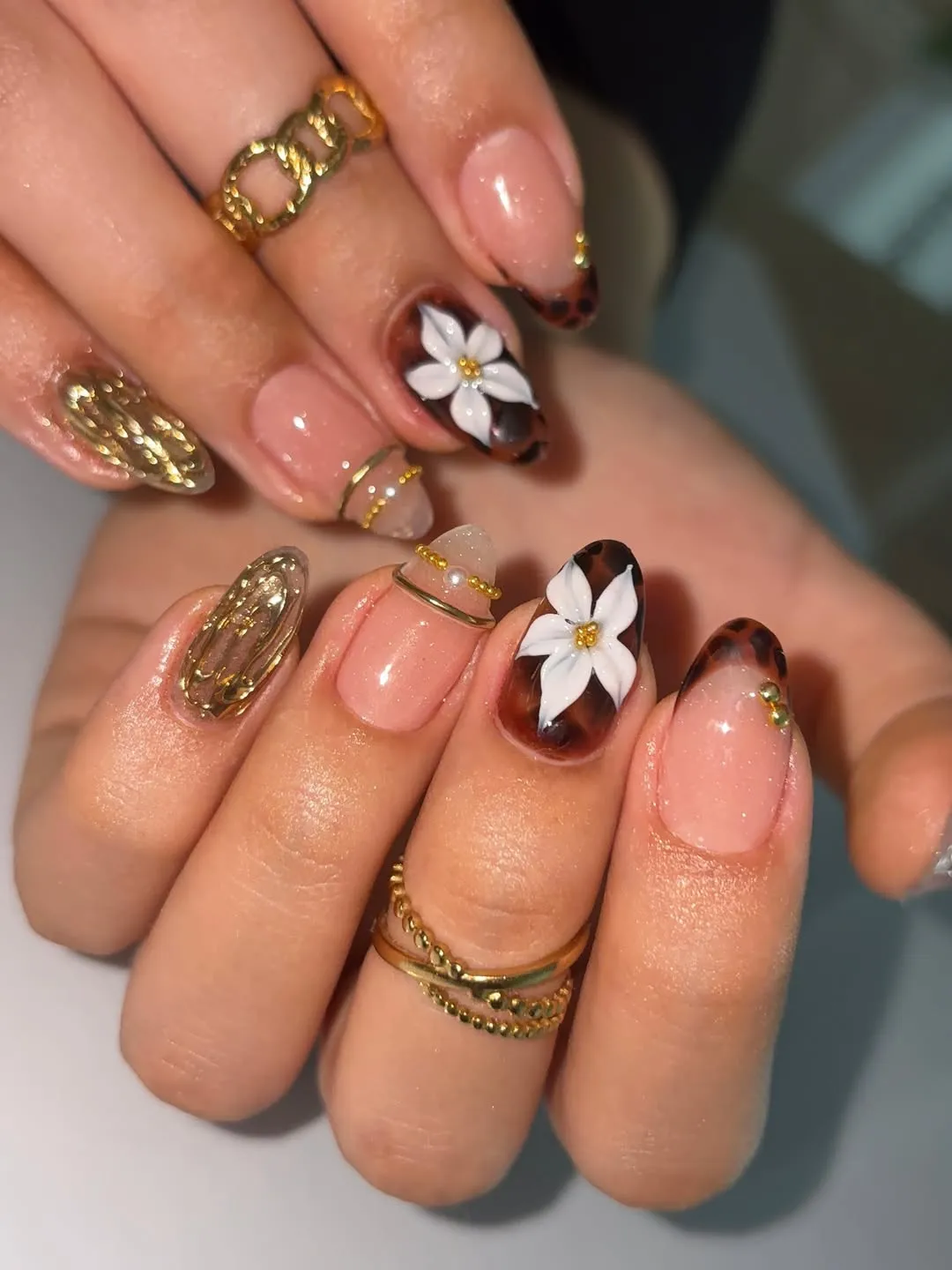 Tortoiseshell tips with white flower accents