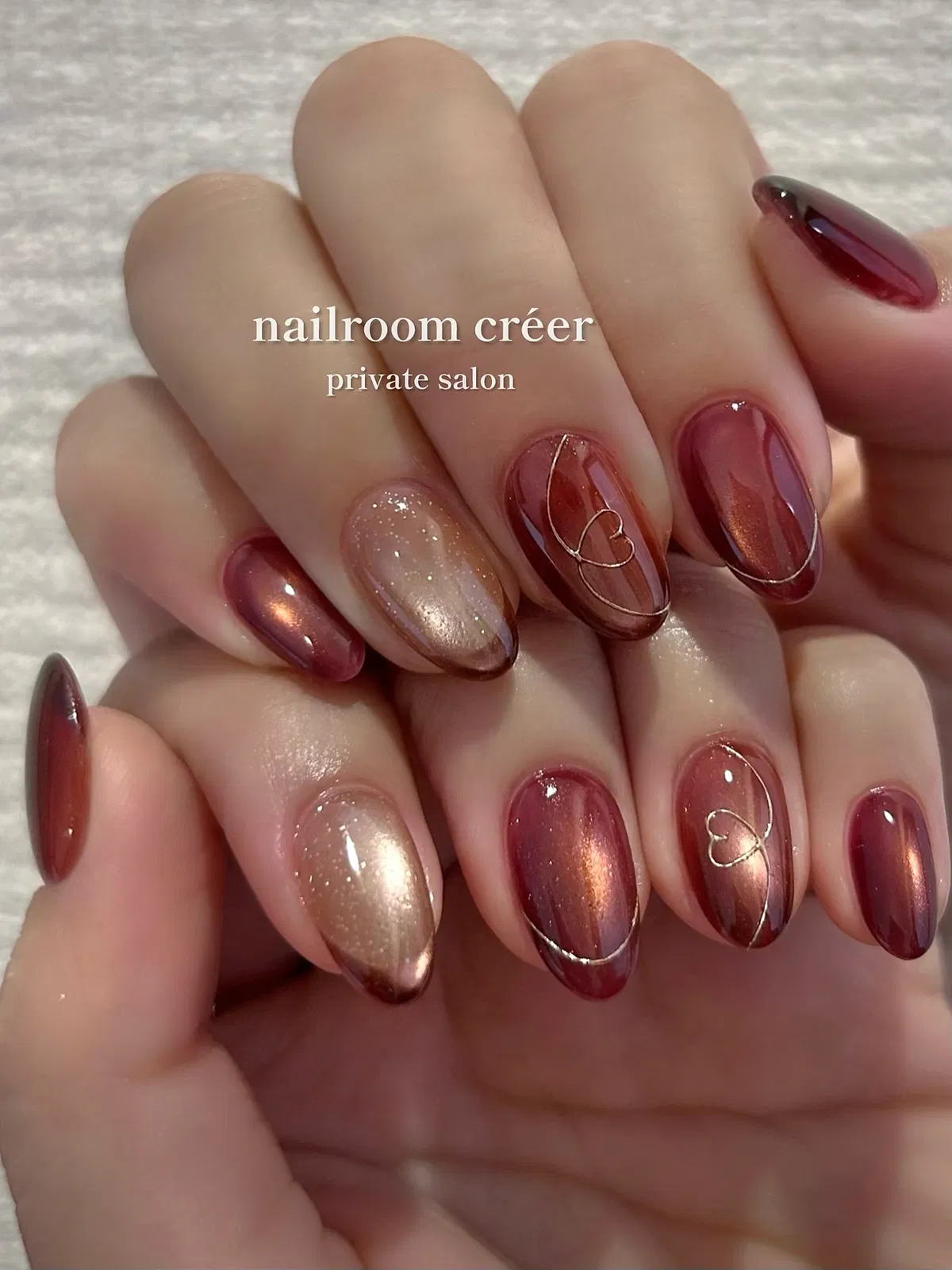 Burgundy cat-eye shine with metallic line art