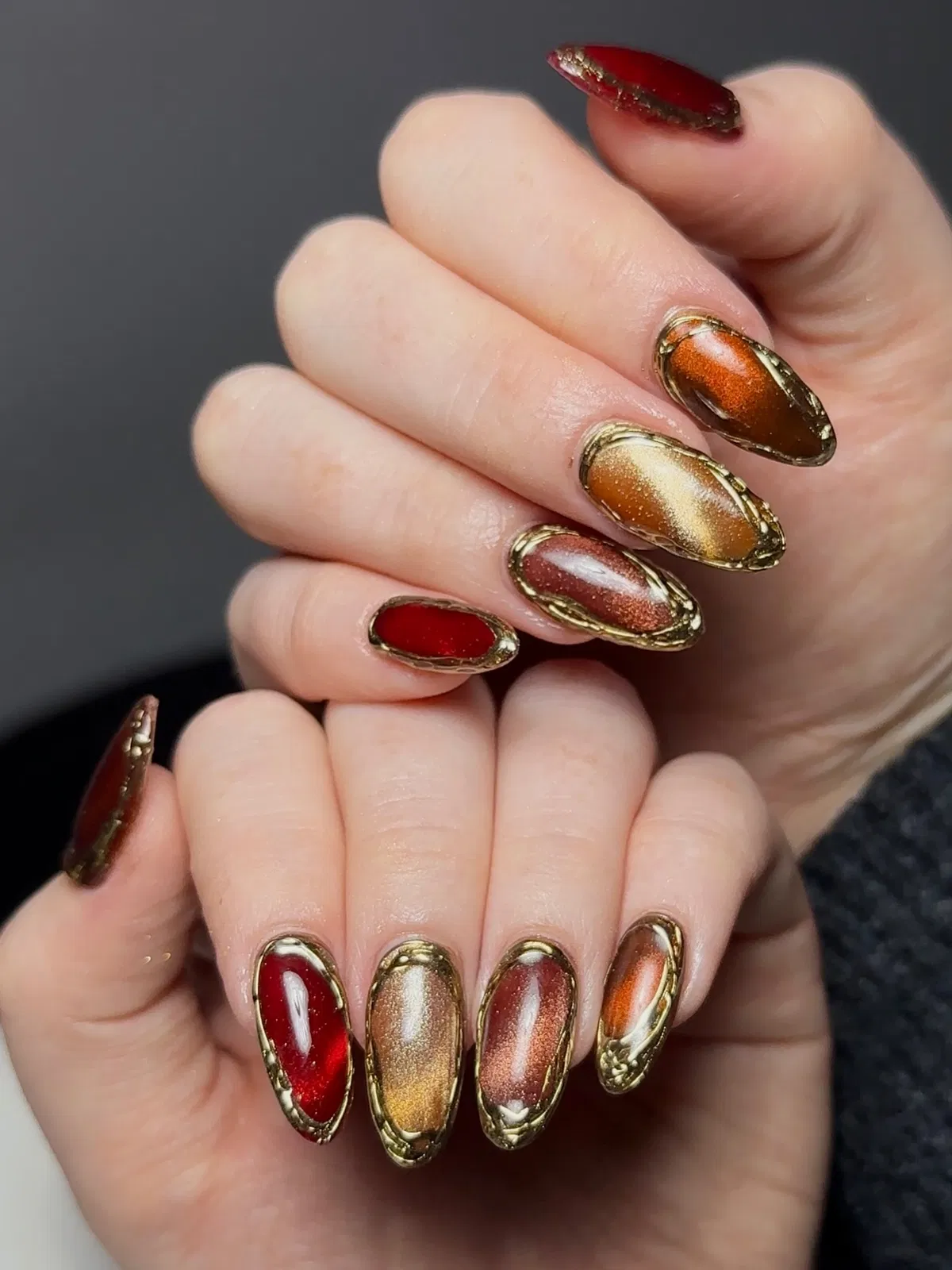 Framed metallic nails with gold borders