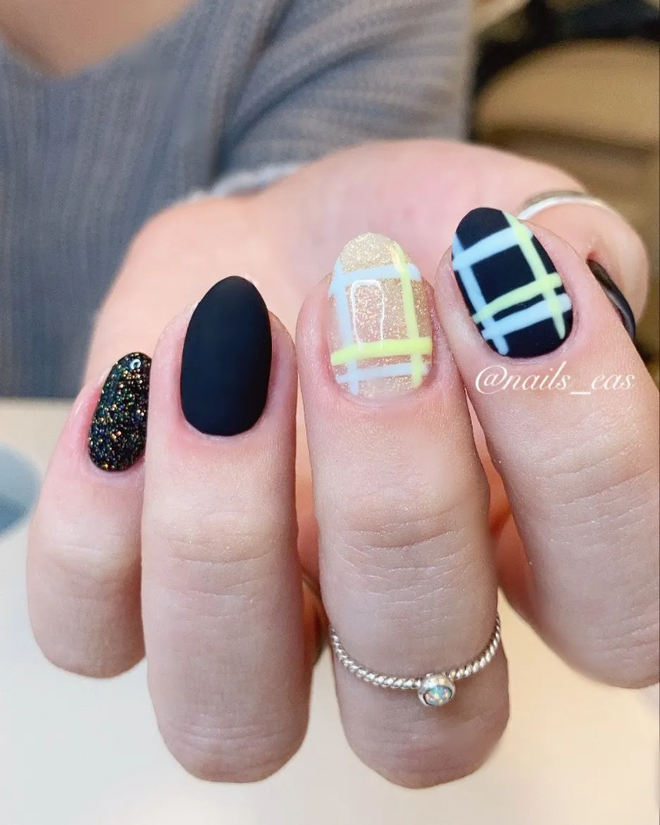 Matte black, glitter accent, and plaid linework