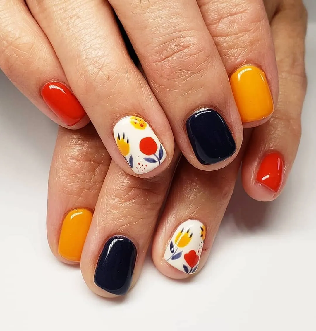 Bold solids with white floral accent nails