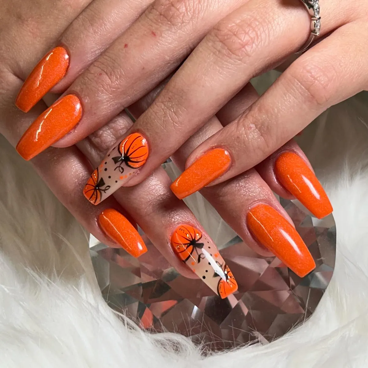 Bright orange glow with pumpkin accents