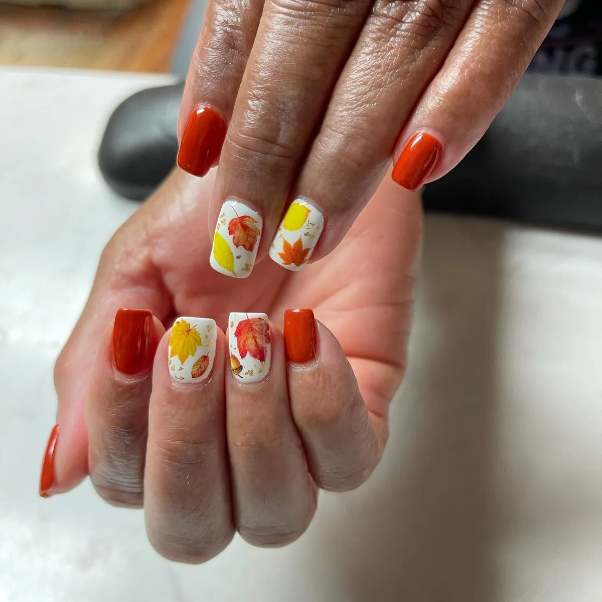 Burnt orange with white leaf-print accents