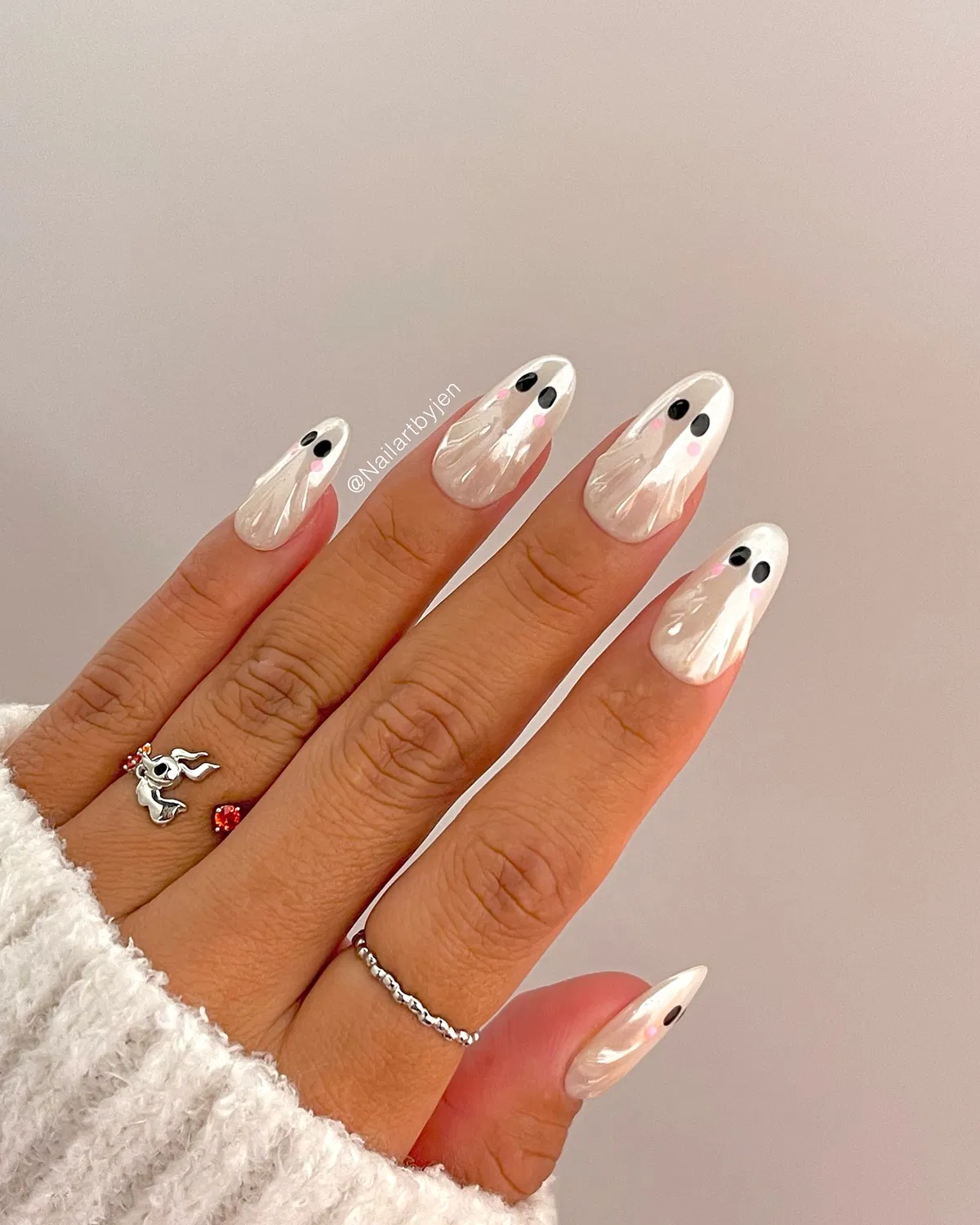 Pearly white nails with simple face-like dot details
