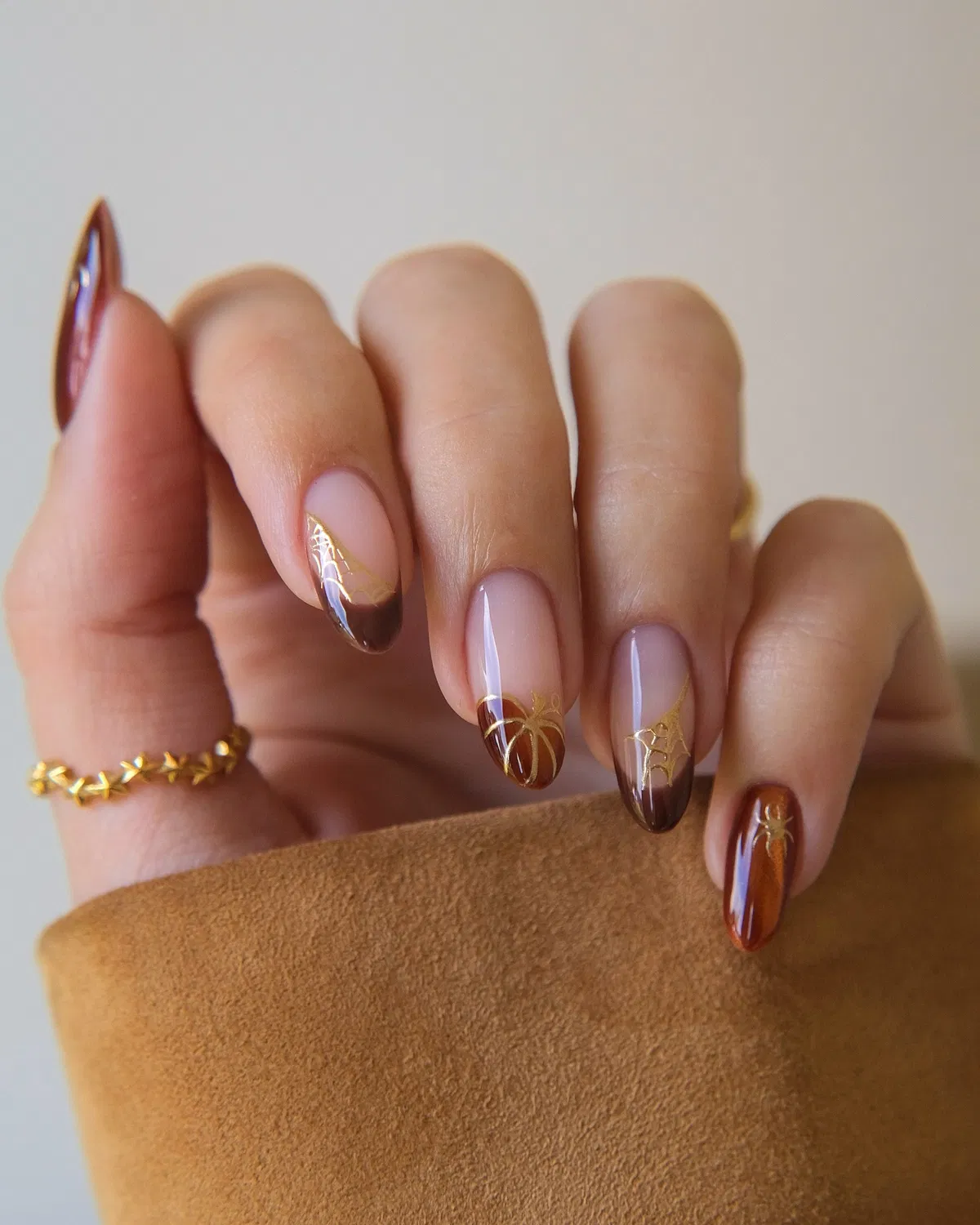Brown French tips with fine gold line art motifs