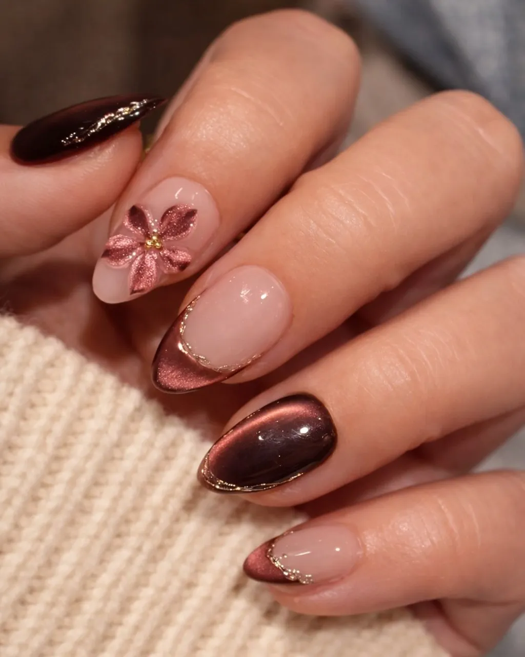 Coppery metallic French tips with floral accent
