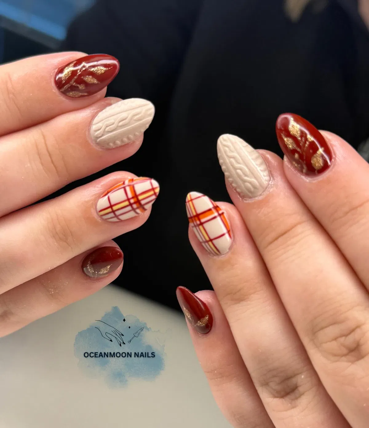 Warm-toned plaid with beige textured nails and red-gold accents