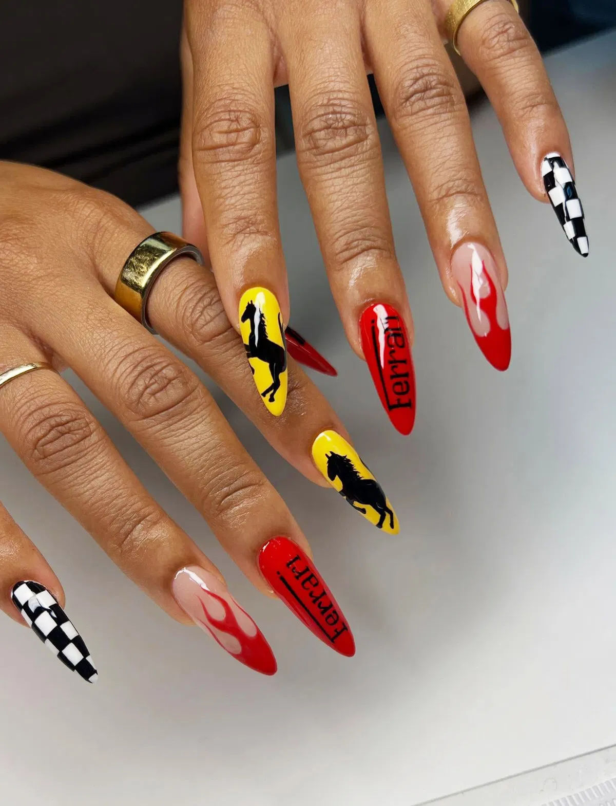 Graphic set with "ferrari" text, checkerboard, flames, and horse silhouettes