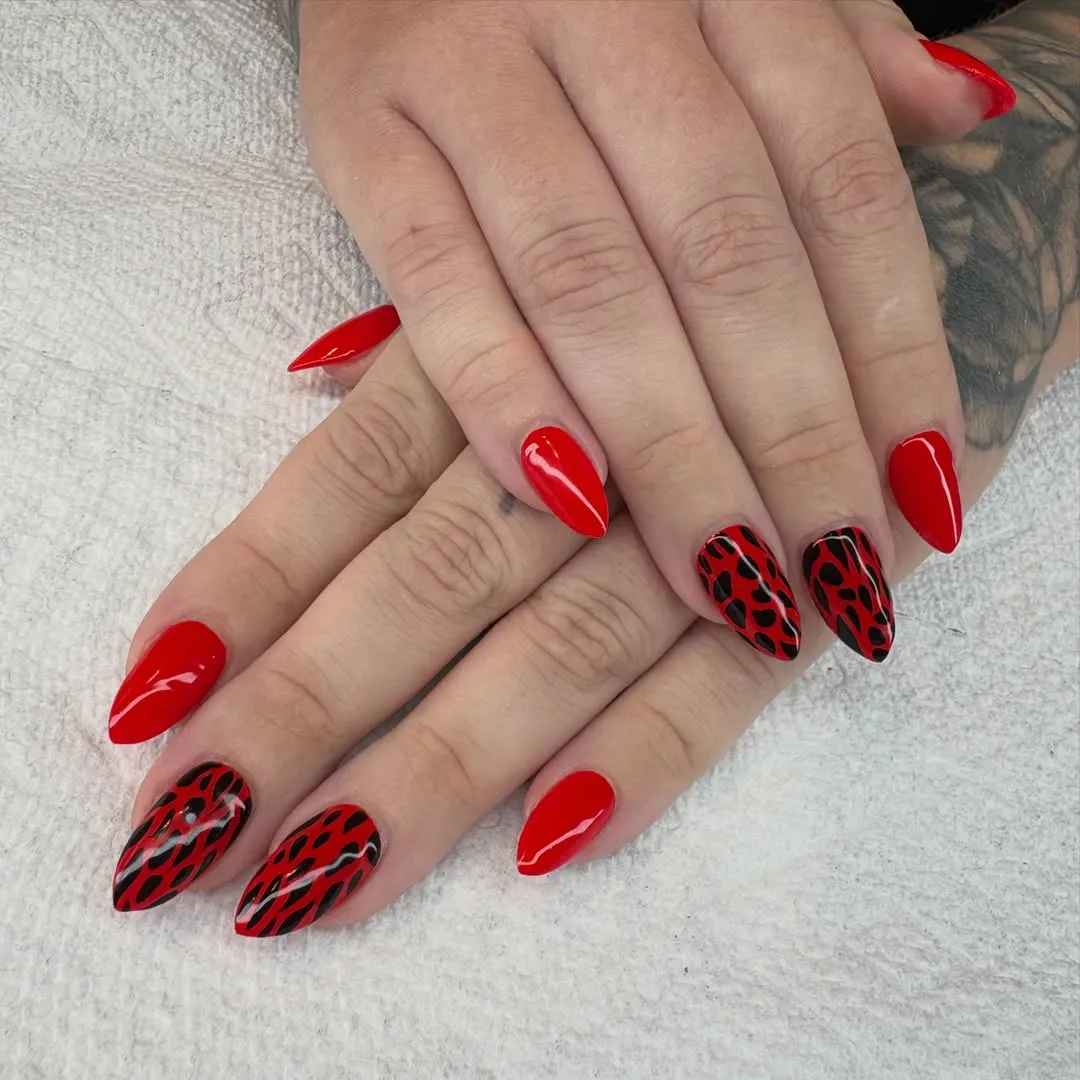 Glossy red with black spotted accent nails