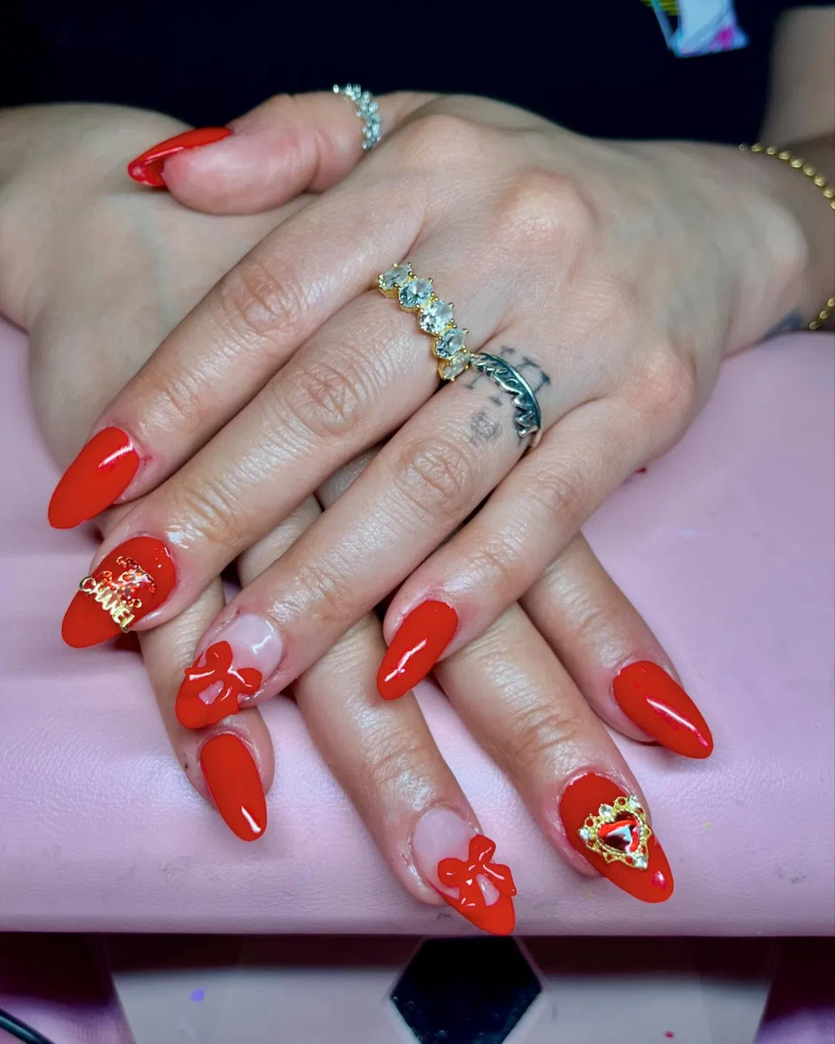 Glossy red with 3D bows, crown-heart, and letter accent
