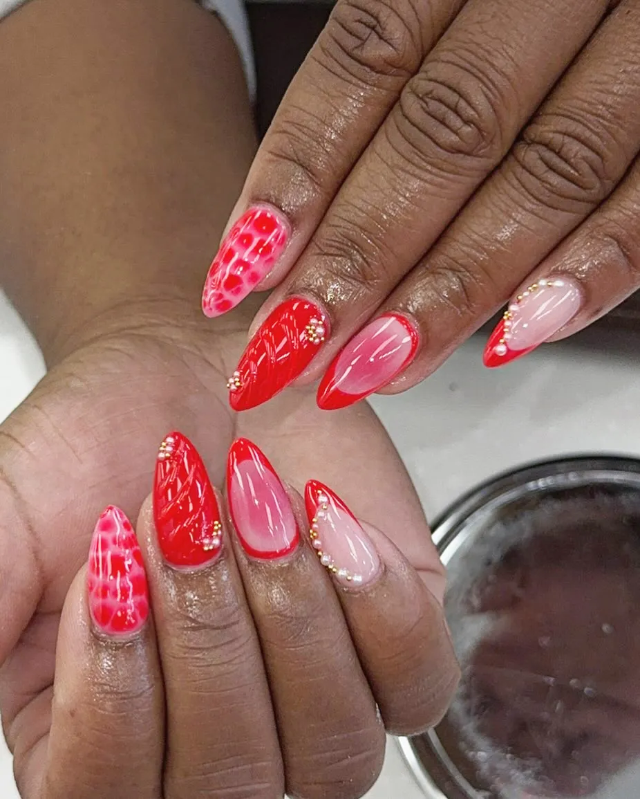 Red mix: solids, French tips, and web-like accents with gold beads