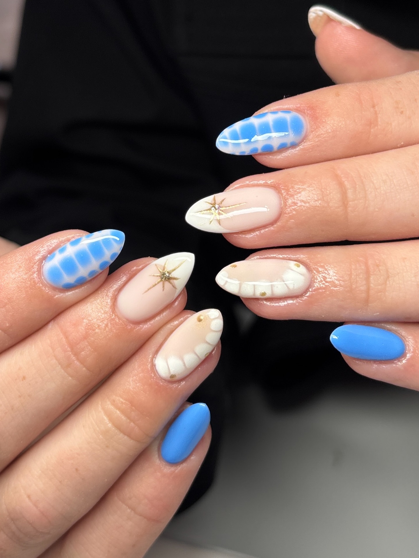 Light blue and milky white with gold starbursts