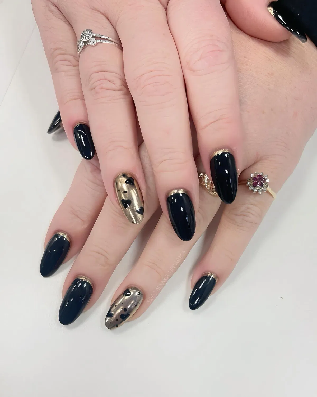 Glossy black with gold accents and gold heart feature nails