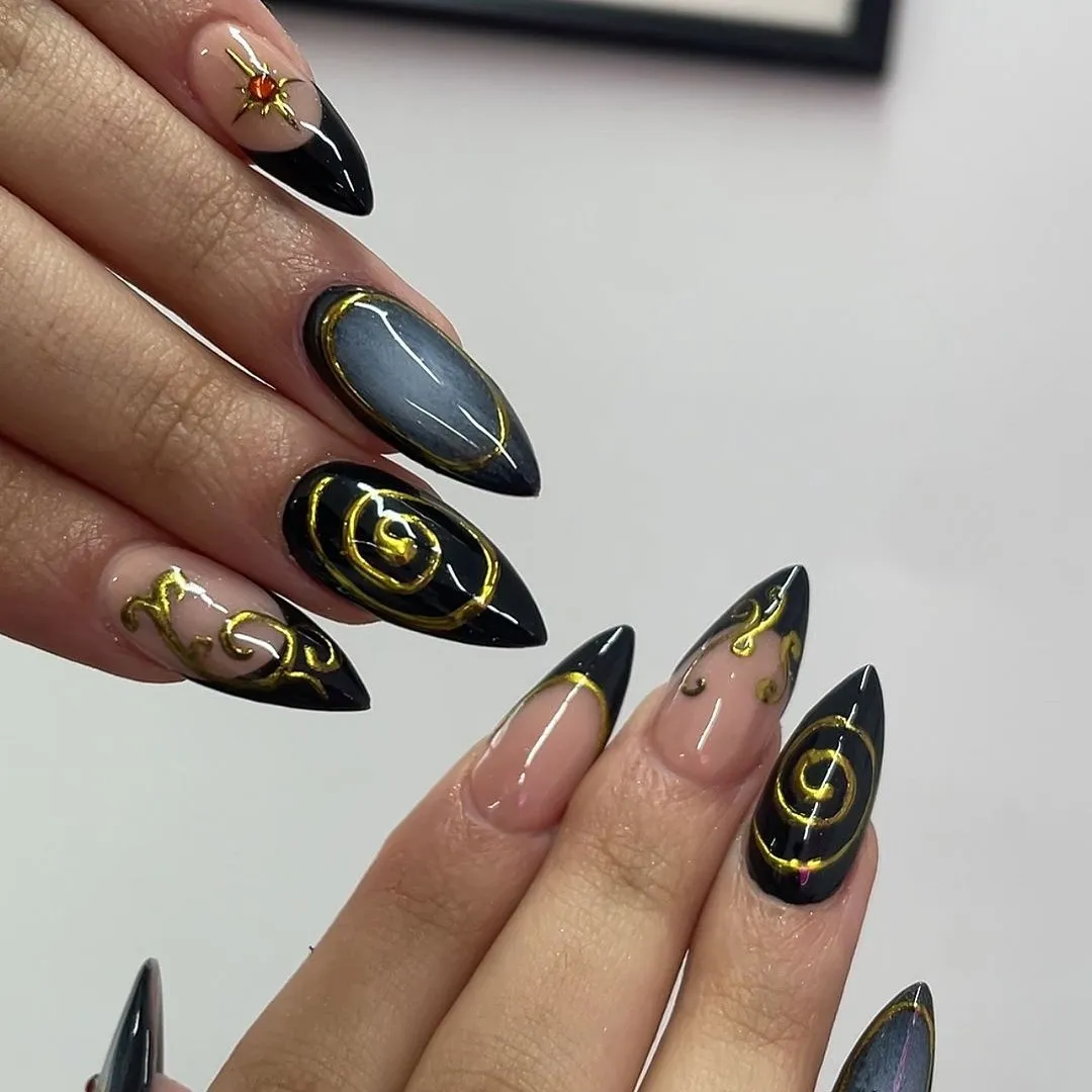 Black-and-nude stilettos with gold swirls and outlined accents