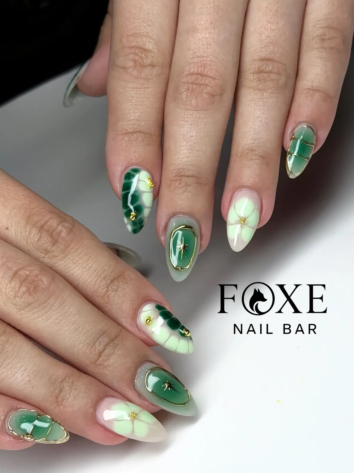 Green-and-white panels with gold framing and star studs