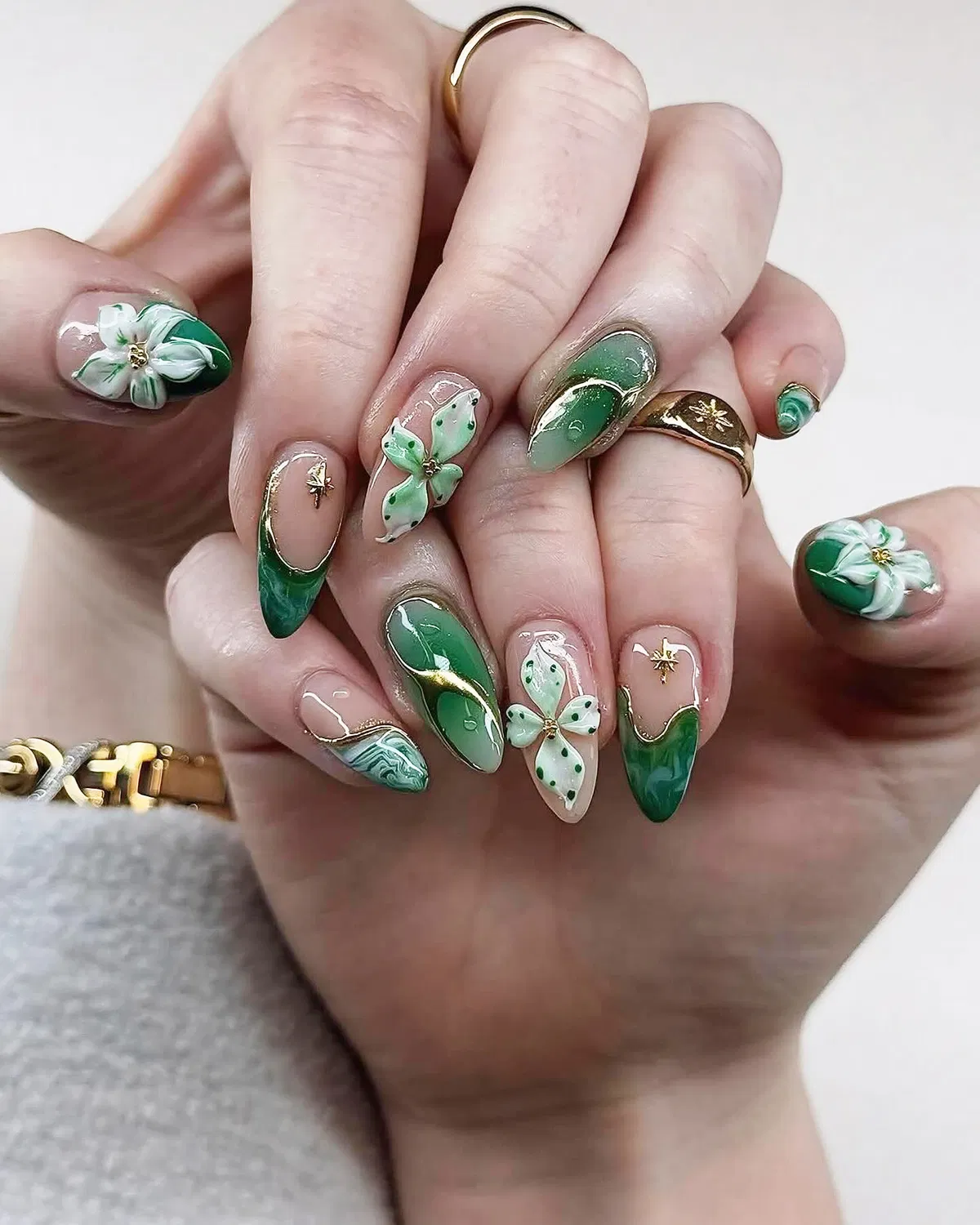Green French tips with white 3D flowers and gold outlines