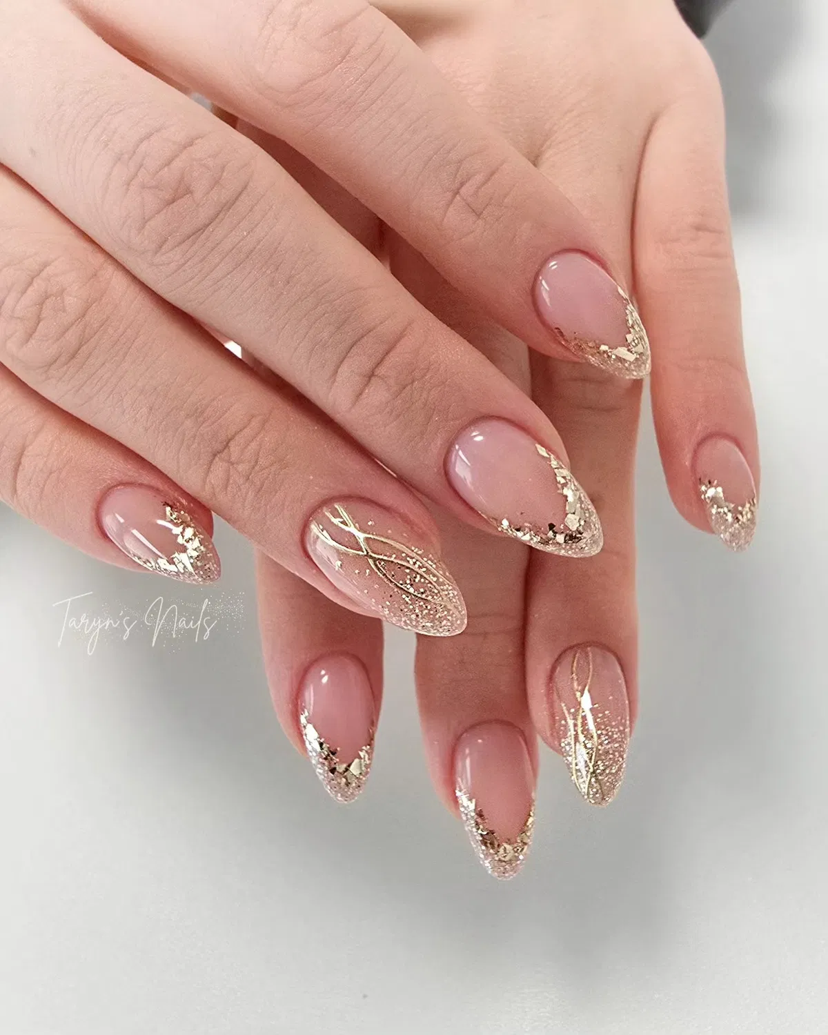 Gold glitter gradient tips with fine line accents