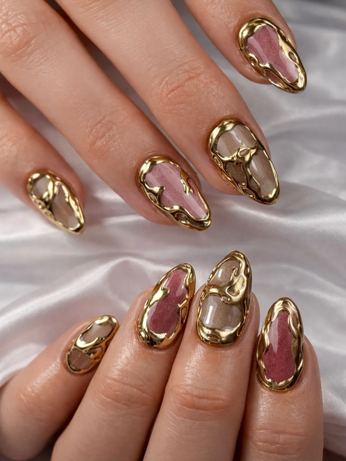 Raised Gold Frame on Mauve and Taupe Almond Nails