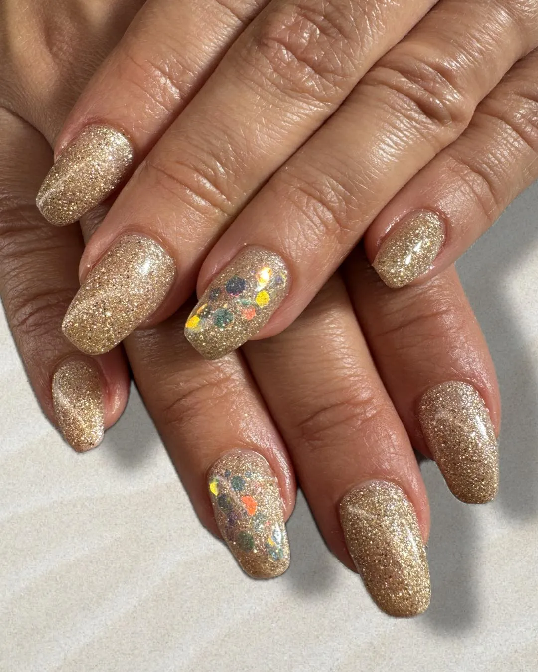 Full gold glitter square nails with multicolor accents
