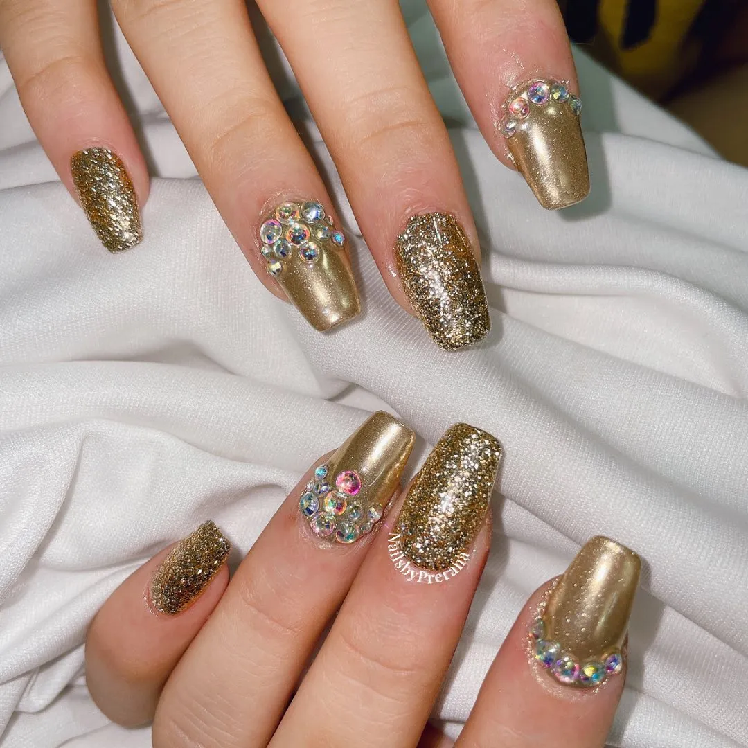 Square metallic gold and full-glitter nails with cuticle rhinestones