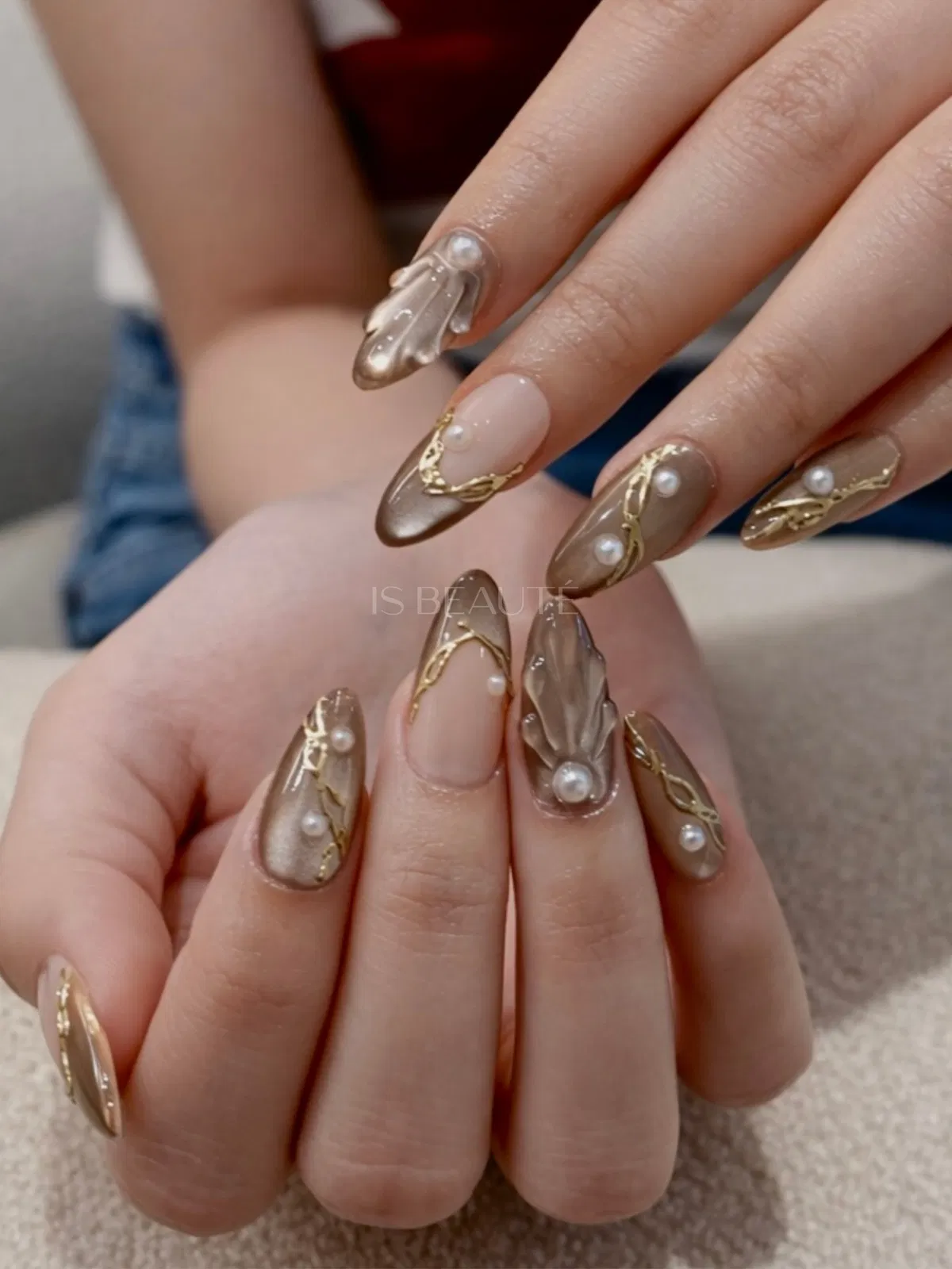 Metallic neutrals with gold waves, pearls, and sculpted 3D accents