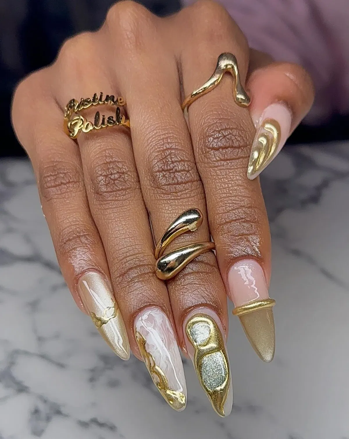 Mixed gold swirls and raised metallic accent nails