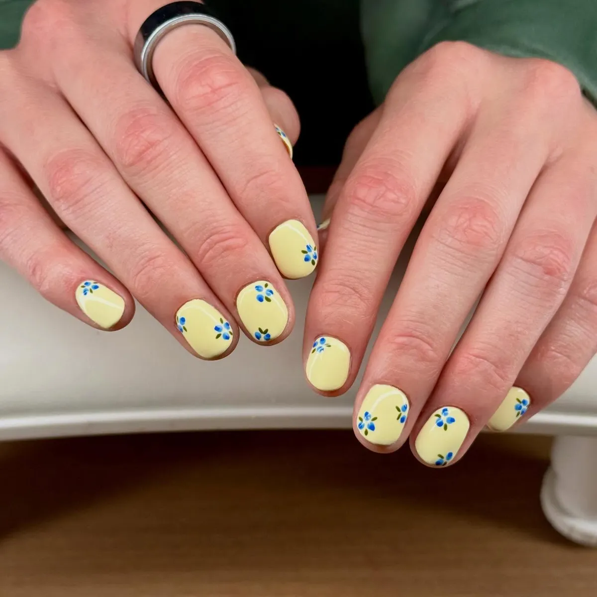 Glossy Light Yellow Short Nails with Tiny Blue Florals