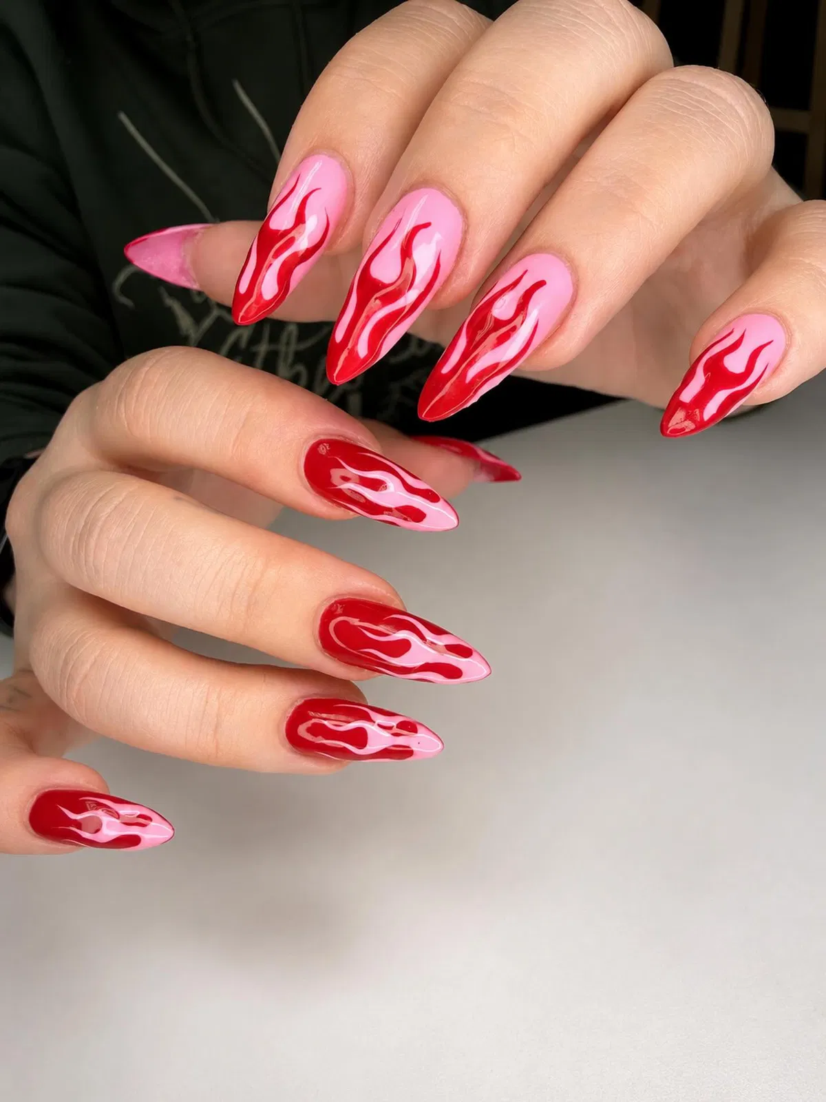 Red Flame Nail Art on Pink Base