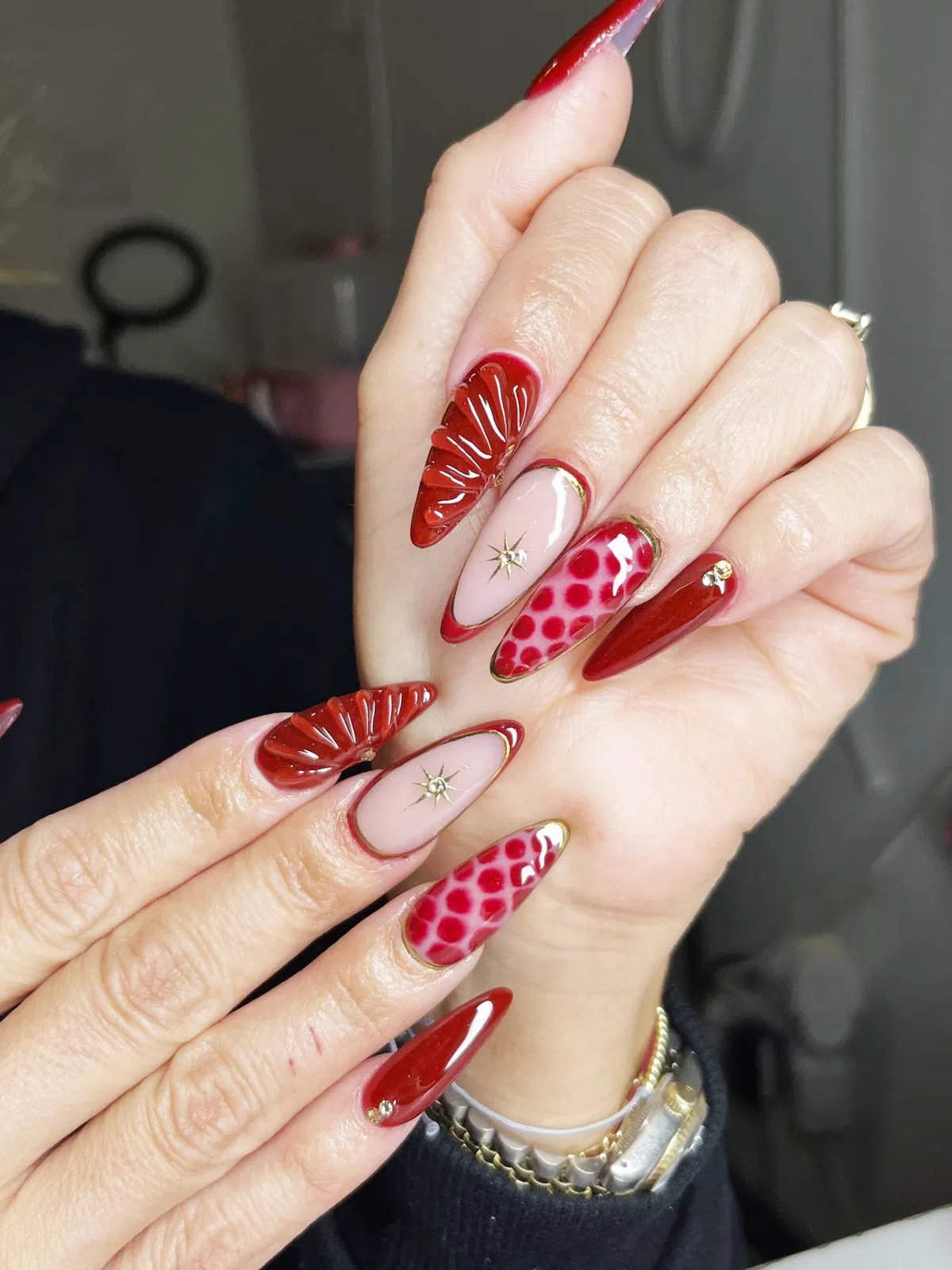 Mixed red set with 3D fan accent and gold starburst charm