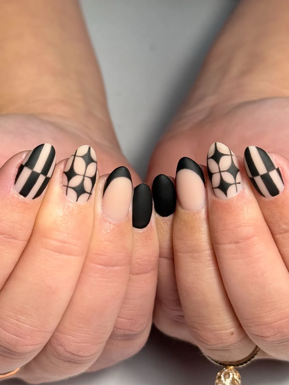 Matte black with nude negative space and graphic line art