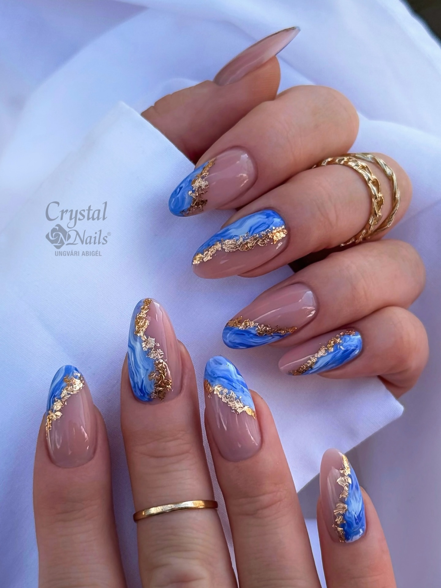 Nude base with blue swirls and gold foil edging