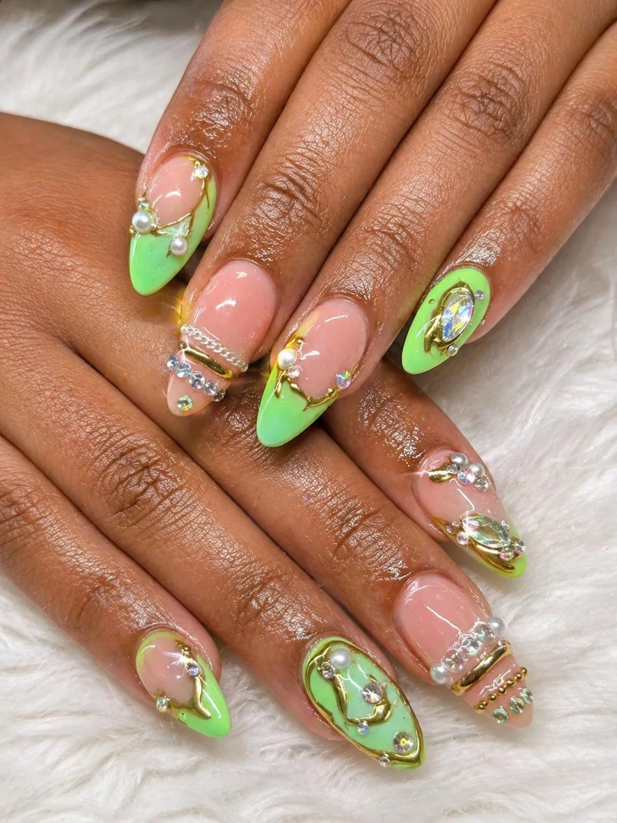 Neon green French tips with gold-toned and gem accents