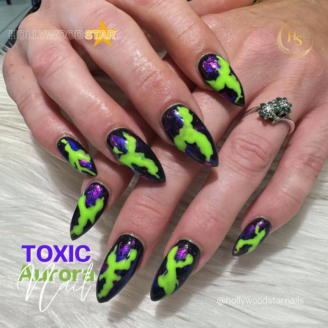 Black stiletto nails with neon green drips and purple shine