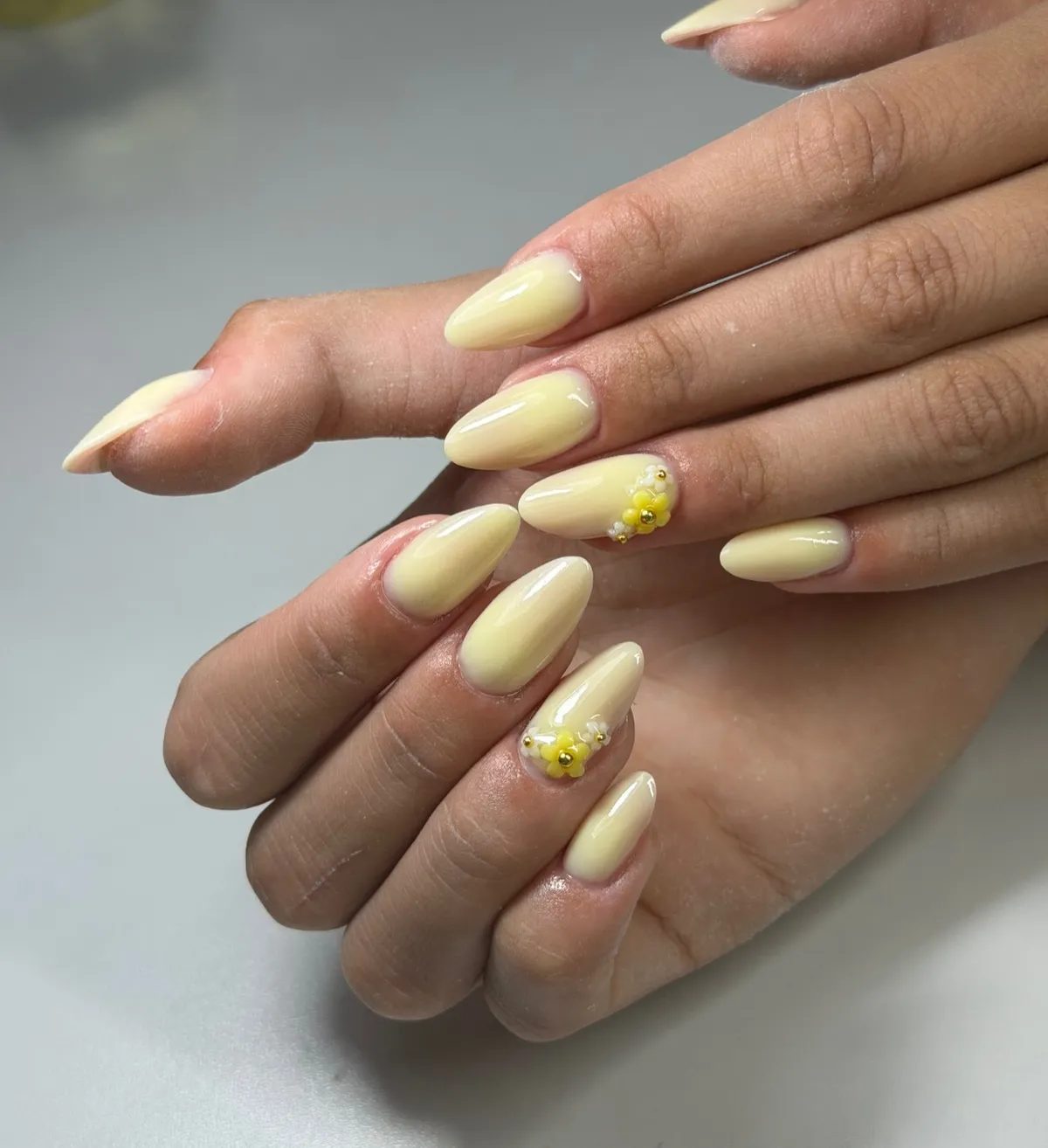 Creamy pale yellow with small 3D flower clusters