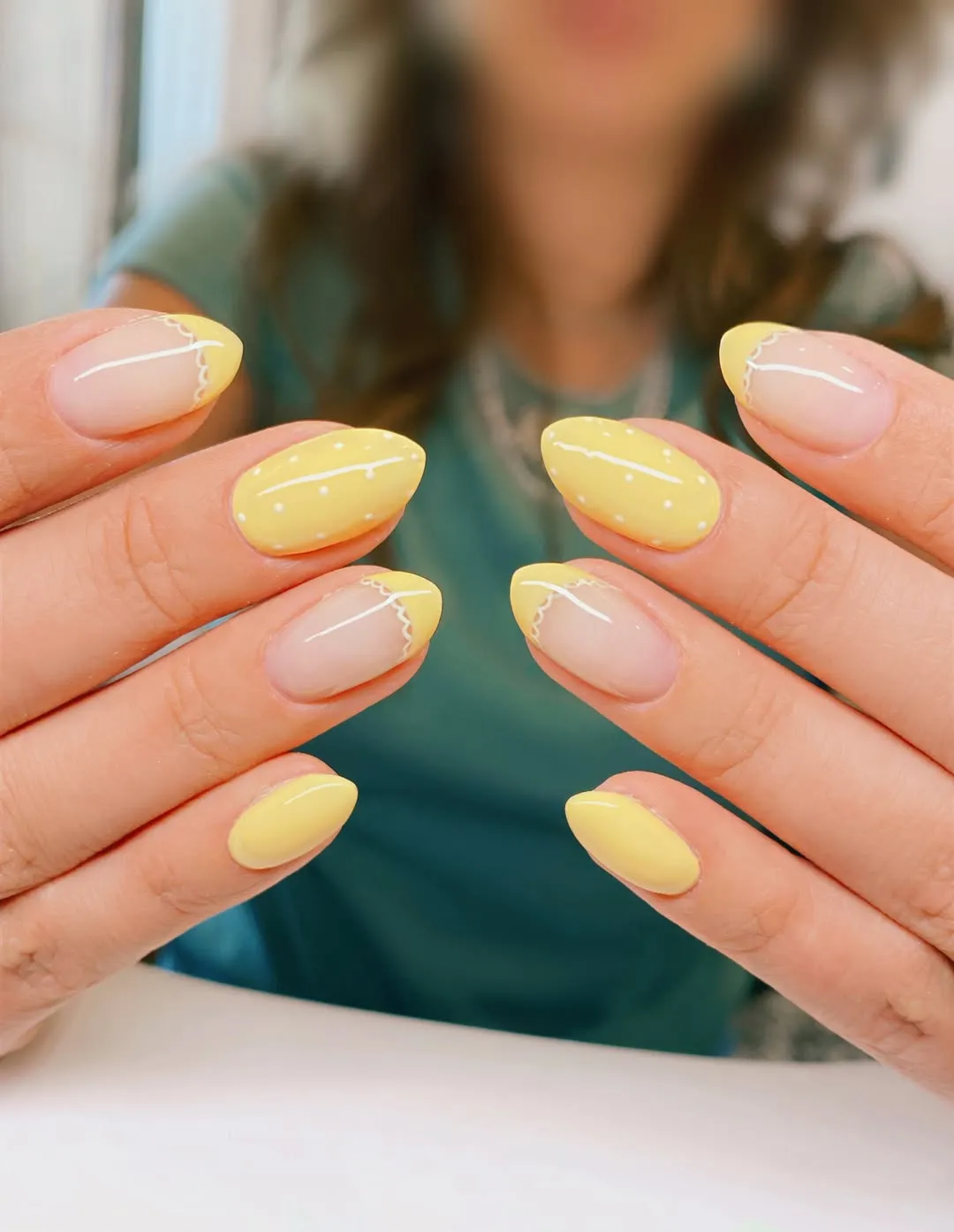 Pastel yellow solids and soft French tips with tiny dot details