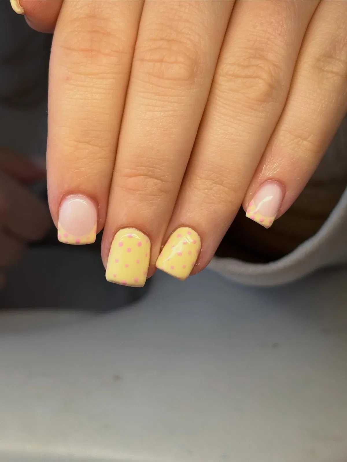 Pastel yellow with pink polka dots and dotted tips